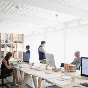 people working in furnished open-plan office space